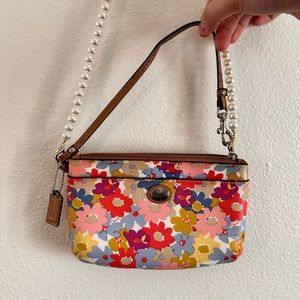 Coach floral wristlet/minicrossbody